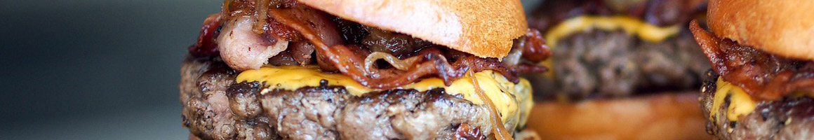Eating Burger at Astro Burgers restaurant in Inglewood, CA.
